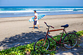 Surfer on a beach.