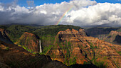Waterfall and a rainbow, looking out across Wiamea Canyon, Kauai