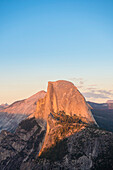 View of Half Dome from Glacier Point as seen at sunset. Yosemite, CA, USA.