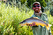 A male guide with a nice Brown on the Green River, UT