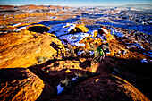 A man riding his mountain bike in the snow outside of St. George, Utah.