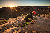 A man mountain biking on the Hymasa trail, Moab, Utah.