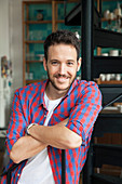 Man with arms folded, portrait