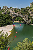 canoes on the river in front of the pont d'arc, gorges of the ardeche, vallon-pont-d'arc, nature reserve of the gorges of the ardeche, ardeche (07), france