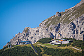the summit of the sareis with the arrival point of the chairlift and the restaurant's chalet, malbun ski resort, principality of liechtenstein