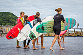 surfers, zurriola beach, san sebastian, donostia, basque country, spain