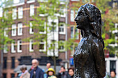 statue of anne frank in front of her house, wertermarkt and princengracht, amsterdam, holland