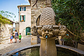 fountain with mascarons, village of seguret, vaucluse (84), paca, provence alpes cote d'azur, france