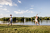 Playing badminton at Lake Bucher reservoir, Rainau, close to Aalen, Ostalbkreis, Baden-Wuerttemberg, Germany
