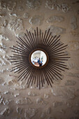 Decorative mirror mounted on wall