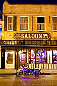 Bike outside a bar in Fort Worth Stockyards at night, Texas, United States of America, North America