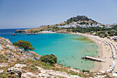 View over the clear turquoise waters of Lindos Bay, Lindos, Rhodes, Dodecanese Islands, South Aegean, Greece, Europe