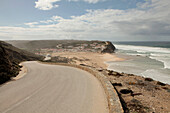 View from a road of a beach and cliffs, Monte Clerigo, Portugal