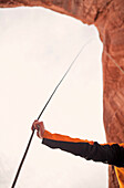 A woman holds her climbing rope.