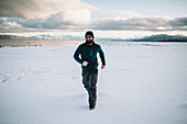 A man running in the snow