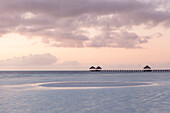 Pristine tropical beach at sunrise and low tide with wooden jetty in Cayo Guillermo. Cuba