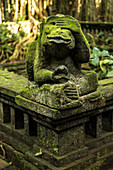 Balinese temple entrance with monkey statues in the temple town of Ubud, Bali, Indonesia