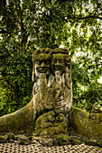 Balinese stone temple figures heads in the city of Temple Ubut, Bali, Indonesia