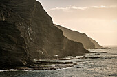 steep cliffs of rocky bay Playa de Alojera, La Gomera, Canary Islands, Spain