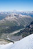 Alpinists descending from Piz Roseg, Rhaetian Alps, canton of Grisons, Switzerland
