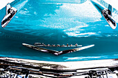 A vintage Chevrolet with a lot of chrome after a rain on the Ocean Drive in the Art Deco district, Miami Beach, Miami, Florida, USA