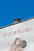 Gemälde eines Liebespaares mit Hamburg Schriftzug an einer Hauswand auf dem Kiez im Stadtteil St. Pauli, Hamburg, Deutschland