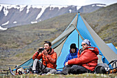 Team enjoys drier climates at base camp while they wait for better wheather conditions during a ski ascent of Mount Sanford Sheep Glacier Route in the Wrangell-St. Elias National Park outside of Glennallen, Alaska June 2011.  Mount Sanford at 16,237 feet 