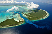 Aerial view of tidal channels feeding central lagoon of raised coral atoll with seawater, Aldabra, Seychelles