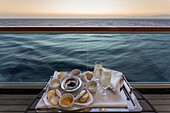 Chilled champagne and caviar with all the trimmings, al fresco on a luxury cruise ship, Red Sea, near Sharm El Sheikh, Egypt, North Africa
