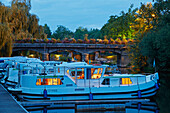 Houseboat in the evening at, La Gacilly, River L'Aff, Canal de Nantes à Brest, Departement Morbihan, Brittany, France, Europe