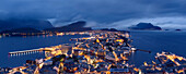 View of the illuminated Old Town seen from the Aksia mountain at dusk, Alesund, More og Romsdal, Norway, Europe