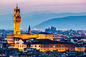 Florence, Tuscany, Italy. cityscape and Palazzo Vecchio. Sunset, lights on.