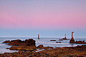 Ouessant island, Brittany, France. Jument lighthouse at dawn from Pointe de Pern.