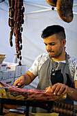 Prosciutto and sausages are part of the offerings at the weekly market in Sulmona