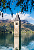 The famous old church tower of Graun in the Reschensee, Graun, Vinschgau, Südtriol, Alto Adige, Italy