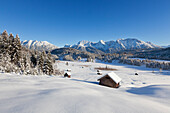 Winter landscape with haystack at Geroldsee, view to Soiern range and Karwendel range, Bavaria, Germany