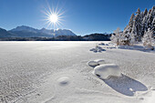 View over the ice at Barmsee to Karwendel range, Bavaria, Germany