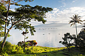 Lake Toba (Danau Toba) and fishing boats at sunrise, North Sumatra, Indonesia, Southeast Asia, Asia