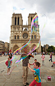 Soap bubbles. Notre Dame Cathedral. Paris. France.