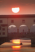 Europe, Italy, Tuscany, Florence, Ponte Vecchio at sunset and Arno river.
