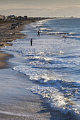 USA, North Carolina, Atlantic Beach, elevated view of surf fishing, morning.