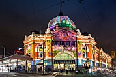 Australia, Victoria, VIC, Melbourne, Flinders Street Train Station, lit with projected laser designs, White Nights Festival.