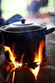Pot on the open fire, cooking water, Papua, Indonesia, Southeast Asia.