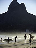 Tourists at the beach, Rio De Janeiro, Brazil.