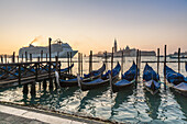 A luxury liner arriving in Venice in the early morning with San Giorgio Maggiore in the background, Italy, Europe