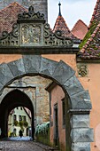 View through the Burgtor (Castle Gate) with timbered houses in the background, Rothenburg ob der Tauber, Bavaria, Germany, Europe