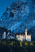 Famous Neuschwanstein Castle (New Swanstone Castle) at night in winter, Hohenschwangau, Bavaria, Germany, Europe