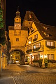 12th century Markusturm (Markus Tower) and Röderbogen (Roeder Arch) with timbered houses at night, Rothenburg ob der Tauber, Bavaria, Germany, Europe