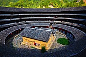 China, Fujian province, Chuxi village, Tulou mud house. well known as the Hakka Tulou region, in Fujian. In 2008, UNESCO granted the Tulou ´´Apartments´´ World Heritage Status, siting the buildings as exceptional examples of a building tradition and funct