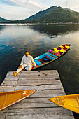 A merchant and his shikara (boat) loaded with flowers, Dal Lake in Srinagar, Kashmir, Jammu and Kashmir State, India.